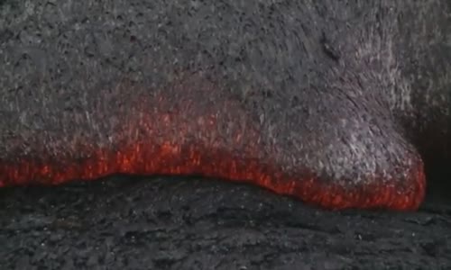 Raw Molten lava consumes shrubs in Pahoa