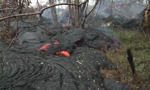 Raw Lava covers headstones in Hawaii cemetery