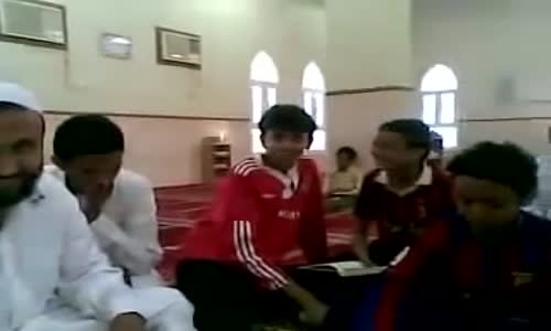 Child in tears while reciting the words of the Almighty in the Quran