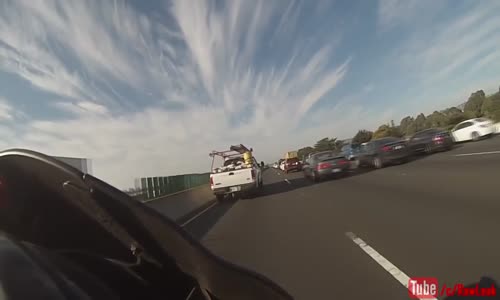 Lexus SUV cuts off motorcyclist 