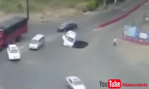 Motorist drives car into large sinkhole 