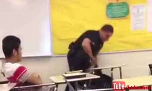 Cop Violently Attacks Peaceful Female Student 