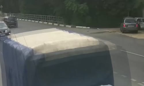 Biker Slams into Turning Car and Almost Flips It 