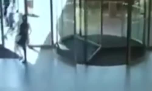 Shoplifting Woman Slams into Revolving Glass Door 