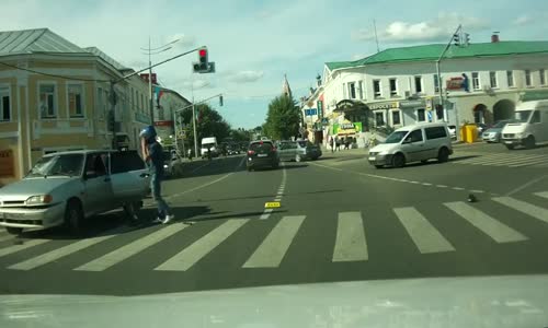 Biker Lands on Car Roof After Crash 