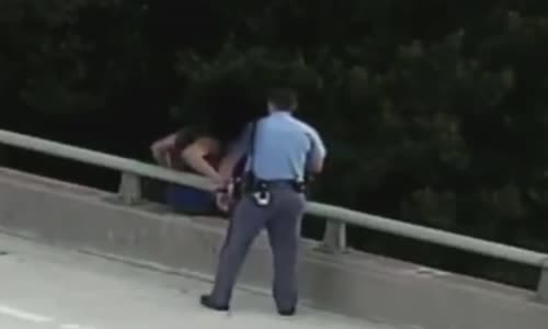 Police officer saves suicidal man and gives him a hug 