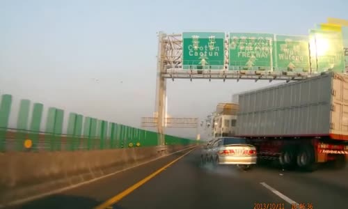 Tire Blow Out Causes Truck to Crush a Car Against Barrier 