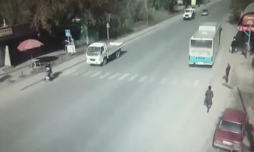 Mother and child cross the road in Kazakhstan 