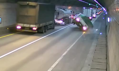 Truck crashes in tunnel and bursts into flames 