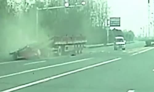 Truck gets crushed by it's own cargo 