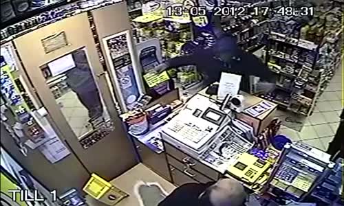 Shopkeeper beats robber with folding chair 