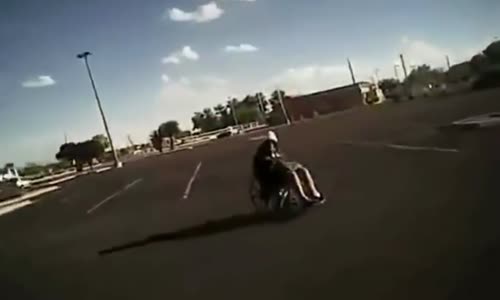 Cop Gets A Work Out Helping Lady In Wheelchair 