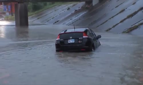 Driver rows his Prius gently down the stream 