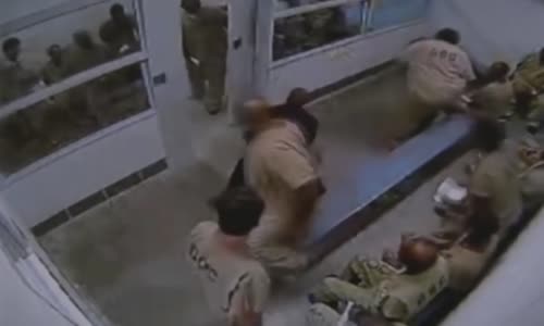 Cook County Jail guard beating combative prisoner 